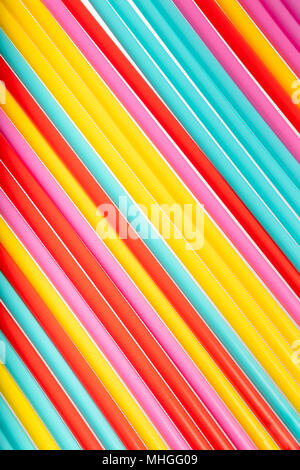 Background with bright color made from many straws, top view, summer conceptual theme, textured background Stock Photo
