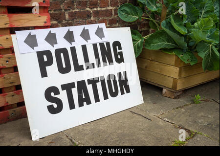 British election polling station sign propped up in an urban garden in the UK Stock Photo