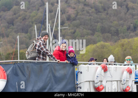 Windermere  UK 1st May  April  2018  Cumbria  Lake  Windermere Family from London get given free Lake Pounds which they spend on local Lake cruise Adela Urbina,Csaba Soos, &  3 year old Abergale . The Lake District Pound (LD£) is region’s new local currency . . Only local businesses can accept the LD£, so you know you’re supporting our communities.annual currency, new designs yearly.  pay,& you can y.   Every LD£ you collect helps  support local businesses, and fund local community & conservation projects through work of Cumbria Community Foundation Credit:Gordon Shoosmith/Alamy Live News Stock Photo