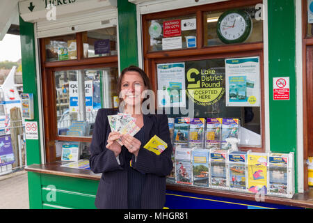 Windermere  UK 1st May  April  2018  Cumbria  Lake  Windermere Family from London get given free Lake Pounds which they spend on local Lake cruise Adela Urbina,Csaba Soos, &  3 year old Abergale . The Lake District Pound (LD£) is region’s new local currency . . Only local businesses can accept the LD£, so you know you’re supporting our communities.annual currency, new designs yearly.  pay,& you can y.   Every LD£ you collect helps  support local businesses, and fund local community & conservation projects through work of Cumbria Community Foundation Credit:Gordon Shoosmith/Alamy Live News Stock Photo