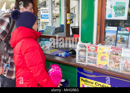 Windermere  UK 1st May  April  2018  Cumbria  Lake  Windermere Family from London get given free Lake Pounds which they spend on local Lake cruise Adela Urbina,Csaba Soos, &  3 year old Abergale . The Lake District Pound (LD£) is region’s new local currency . . Only local businesses can accept the LD£, so you know you’re supporting our communities.annual currency, new designs yearly.  pay,& you can y.   Every LD£ you collect helps  support local businesses, and fund local community & conservation projects through work of Cumbria Community Foundation Credit:Gordon Shoosmith/Alamy Live News Stock Photo