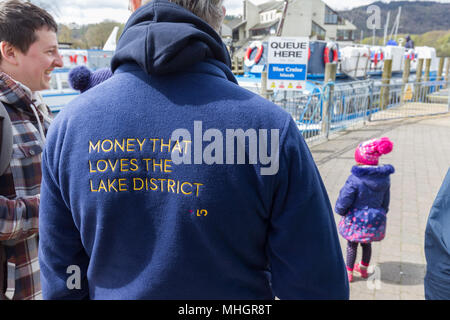 Windermere  UK 1st May  April  2018  Cumbria  Lake  Windermere Family from London get given free Lake Pounds which they spend on local Lake cruise Adela Urbina,Csaba Soos, &  3 year old Abergale . The Lake District Pound (LD£) is region’s new local currency . . Only local businesses can accept the LD£, so you know you’re supporting our communities.annual currency, new designs yearly.  pay,& you can y.   Every LD£ you collect helps  support local businesses, and fund local community & conservation projects through work of Cumbria Community Foundation Credit:Gordon Shoosmith/Alamy Live News Stock Photo