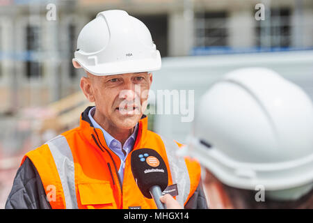 Cazis, Switzerland, 1st May 2018. Markus Dünner, Head of the building authorities of the canton of Grisons is interviewed during the media event on the topping out of the new penal institution Realta in Cazis. Credit: Rolf Simeon/Alamy Live News Stock Photo