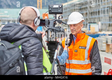 Cazis, Switzerland, 1st May 2018. Markus Dünner, Head of the building authorities of the canton of Grisons is interviewed during the media event on the topping out of the new penal institution Realta in Cazis. Credit: Rolf Simeon/Alamy Live News Stock Photo