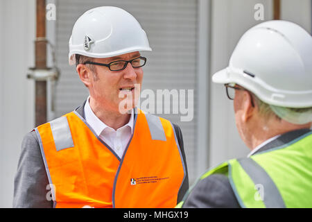 Cazis, Switzerland, 1st May 2018. Member of the Government and Head of Department of Justice Dr. Christian  Rathgeb is interviewed during the media event on the topping out of the new penal institution Realta in Cazis. Credit: Rolf Simeon/Alamy Live News Stock Photo