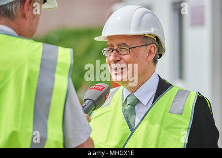 Cazis, Switzerland, 1st May 2018. Mathias Fässler, Head of correctional authorities of the canton of Grisons is interviewed  during the media event on the topping out of the new penal institution Realta in Cazis. Credit: Rolf Simeon/Alamy Live News Stock Photo