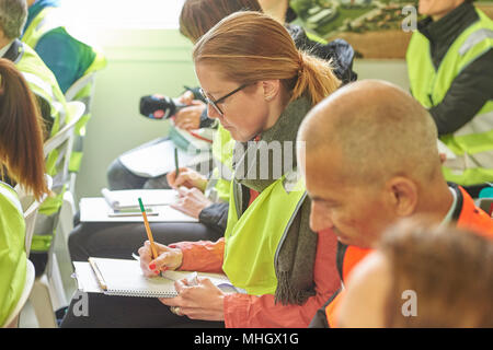 Cazis, Switzerland, 1st May 2018. Media representatives take notes during the media event on the topping out of the new penal institution Realta in Cazis. Credit: Rolf Simeon/Alamy Live News Stock Photo