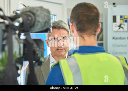 Cazis, Switzerland, 1st May 2018. President of the Government Dr. Mario Cavigelli is interviewed during the media event on the topping out of the new penal institution Realta in Cazis. Credit: Rolf Simeon/Alamy Live News Stock Photo