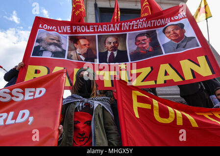 London, UK.  1 May 2018.  Demonstrators hold up banners and placards around Nelson's Column during the annual May Day Rally on International Workers' Day.  Participants marched through central London to a rally in Trafalgar Square. Credit: Stephen Chung / Alamy Live News Stock Photo