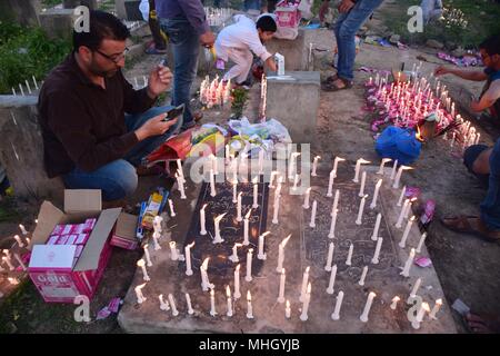 A Kashmiri Shia Muslim light candles on graves on the occasion of Shab-e-Baraat. Every year, Shab-e-Barat is observed on the night between 14th and 15th of Sha'aban, which is the eighth month of the Islamic calendar. According to Islam, Shab-e-Barat means the night of forgiveness. It is considered to be the night when Allah forgives sinners. Shab-e-Barat is also known as Bara'a Night and Mid-Sha'ban. In The Arab world, it's referred to as Laylat al-Bara'at. The festival falls in the run up to Ramadan and is considered the night when Allah forgives sinners.