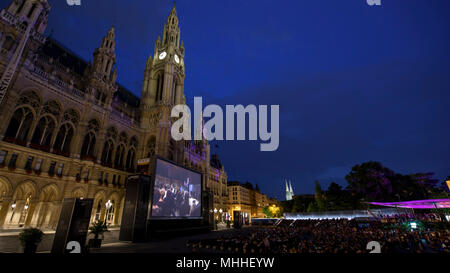 The Film Festival on Rathausplatz is free in the summer Vienna, Austria. The Rathaus building is behind the screen. Stock Photo