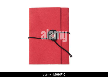 Red pocket notepad closed with twine isolated on white background, top view Stock Photo