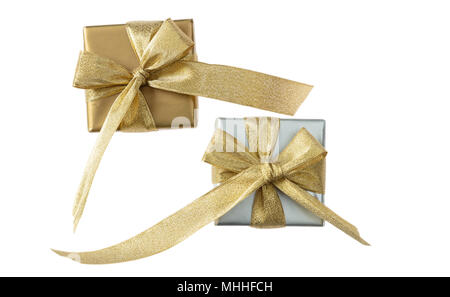 Silver and golden gift boxes with golden ribbons isolated on white background, top view Stock Photo