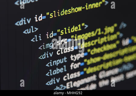 Real Html code developing screen. Programing workflow abstract algorithm concept. Lines of Html code visible. Stock Photo