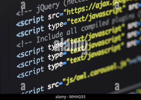 Real Html code developing screen. Programing workflow abstract algorithm concept. Lines of Html code visible. Stock Photo