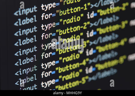 Real Html code developing screen. Programing workflow abstract algorithm concept. Lines of Html code visible. Stock Photo