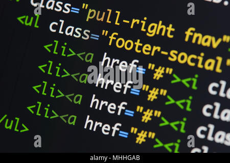 Real Html code developing screen. Programing workflow abstract algorithm concept. Lines of Html code visible. Stock Photo
