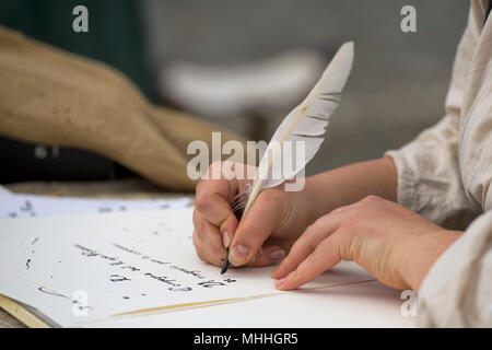 hands while writing a letter with a plume Stock Photo