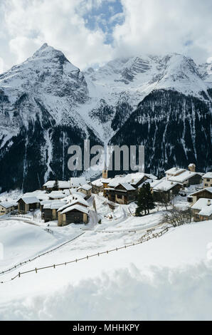 small alpine village winter landscape in Switzerland Stock Photo