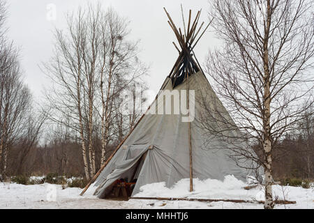 tepee in the snow of arctic night background Stock Photo
