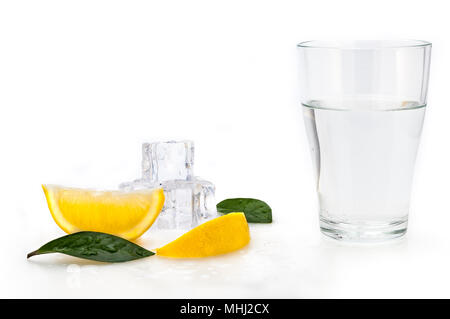 A glass beaker with crystal clear water and ice cubes. Isolated. Stock Photo
