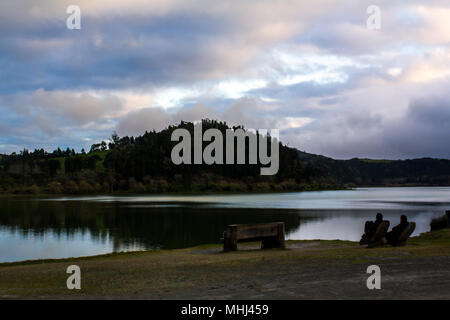 Peaceful landscape with lake and forest at dusk Stock Photo