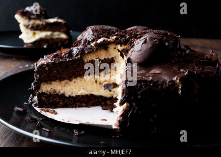 Chocolate Profiterole Cake on Black Plate. Dessert Concept. Stock Photo
