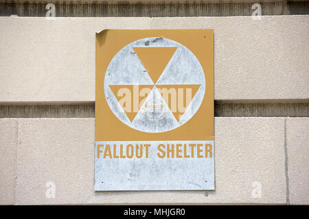 yellow fallout shelter sign on a building Stock Photo