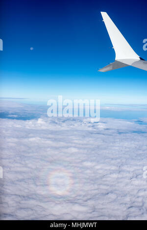 A small circular rainbow, known as a 'glory,' from an airplane.d Stock Photo