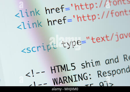 Real Html code developing screen. Programing workflow abstract algorithm concept. Lines of Html code visible. Stock Photo
