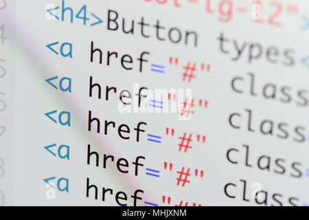 Real Html code developing screen. Programing workflow abstract algorithm concept. Lines of Html code visible. Stock Photo