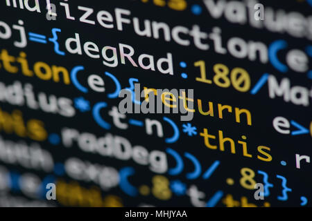 Real Java Script code developing screen. Programing workflow abstract algorithm concept. Closeup of Java Script and HTML code. Stock Photo