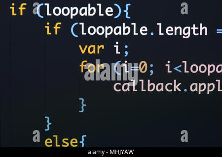Real Java Script code developing screen. Programing workflow abstract algorithm concept. Closeup of Java Script and HTML code. Stock Photo