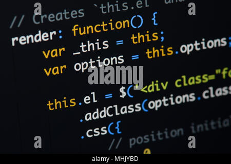 Real Java Script code developing screen. Programing workflow abstract algorithm concept. Closeup of Java Script and HTML code. Stock Photo
