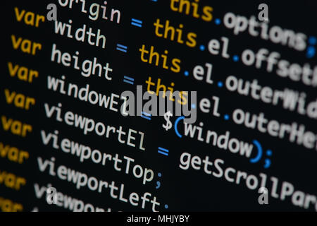 Real Java Script code developing screen. Programing workflow abstract algorithm concept. Closeup of Java Script and HTML code. Stock Photo