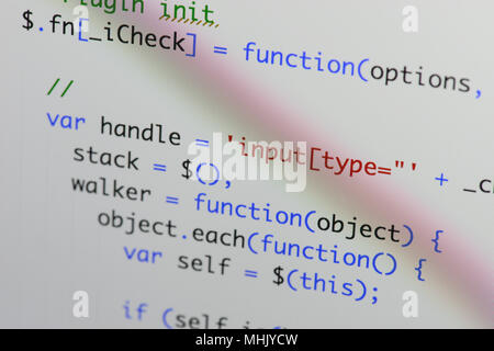 Real Java Script code developing screen. Programing workflow abstract algorithm concept. Closeup of Java Script and HTML code. Stock Photo