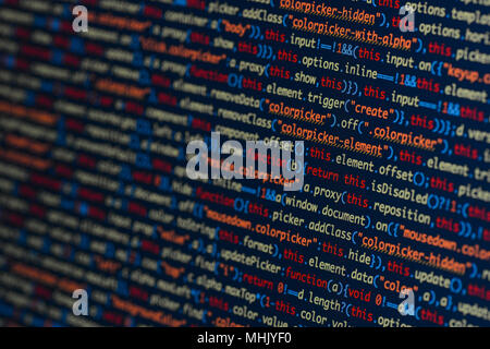 Real Java Script code developing screen. Programing workflow abstract algorithm concept. Closeup of Java Script and HTML code. Stock Photo