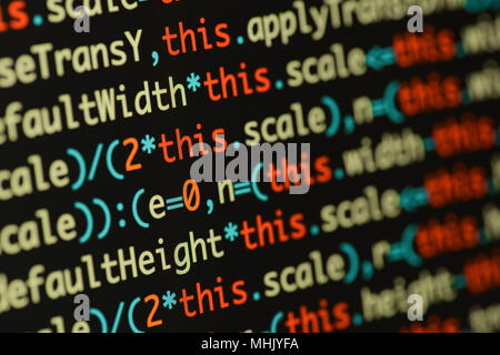 Real Java Script code developing screen. Programing workflow abstract algorithm concept. Closeup of Java Script and HTML code. Stock Photo