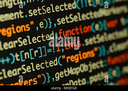 Real Java Script code developing screen. Programing workflow abstract algorithm concept. Closeup of Java Script and HTML code. Stock Photo