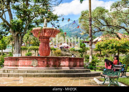 San Juan del Obispo, Guatemala - June 24, 2016: Fountain & St John's Day fair in village named after the patron saint on slopes of Agua Volcano. Stock Photo