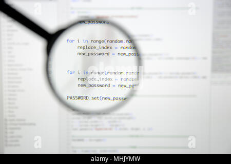 Real Python code developing screen. Programing workflow abstract algorithm concept. Lines of Python code visible under magnifying lens. Stock Photo