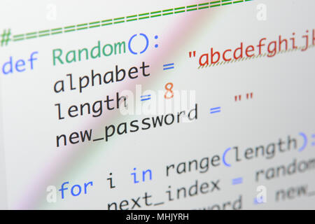 Real Python code developing screen. Programing workflow abstract algorithm concept. Lines of Python code visible under magnifying lens. Stock Photo