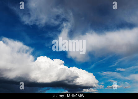 Cumulus clouds against a clear blue Colorado sky Stock Photo