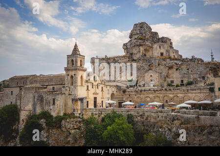 Matera (Italy), September 2017. Church of San Pietro Caveoso with the typical cave dwellings. Landscape format. Stock Photo