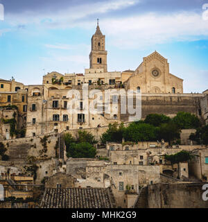 Matera (italy), September 2017. View of the Cathedral dedicated to the Virgin Mary and Saint Eustace, with the surrounding 'Sassi'. Square format. Stock Photo