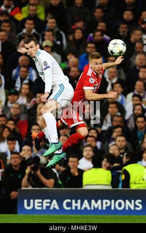 Madrid, Spain. 1st May, 2018. Real Madrid's Gareth Bale (L) plays aerial ball during a UEFA Champions League semifinal second leg soccer match between?Spanish team Real Madrid and German team Bayern Munchen in Madrid, Spain, on May 1, 2018. The match ended 2-2. Real Madrid advanced to the final with 4-3 on aggregate. Credit: Guo Qiuda/Xinhua/Alamy Live News Stock Photo