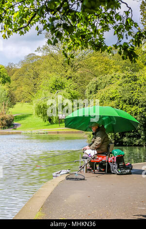 Northampton,UK. 2nd May 2018. UK Weather: After days of heavy rain these anglers in Abington Park,Northampton wasted no time in getting their tackle out to fish in the lake.Angling is one of the most widely supported activities in the UK Stock Photo
