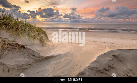 Sunset View on North Sea and Canal fom dunes in Zeeland, Netherlands Stock Photo