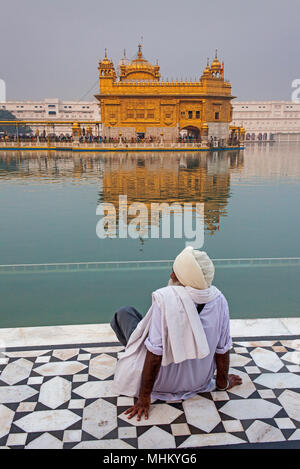 pilgrim and sacred pool Amrit Sarovar, Golden temple, Amritsar, Punjab, India Stock Photo