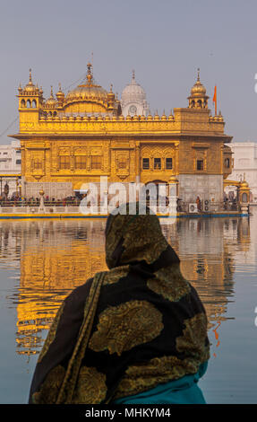 pilgrim and sacred pool Amrit Sarovar, Golden temple, Amritsar, Punjab, India Stock Photo